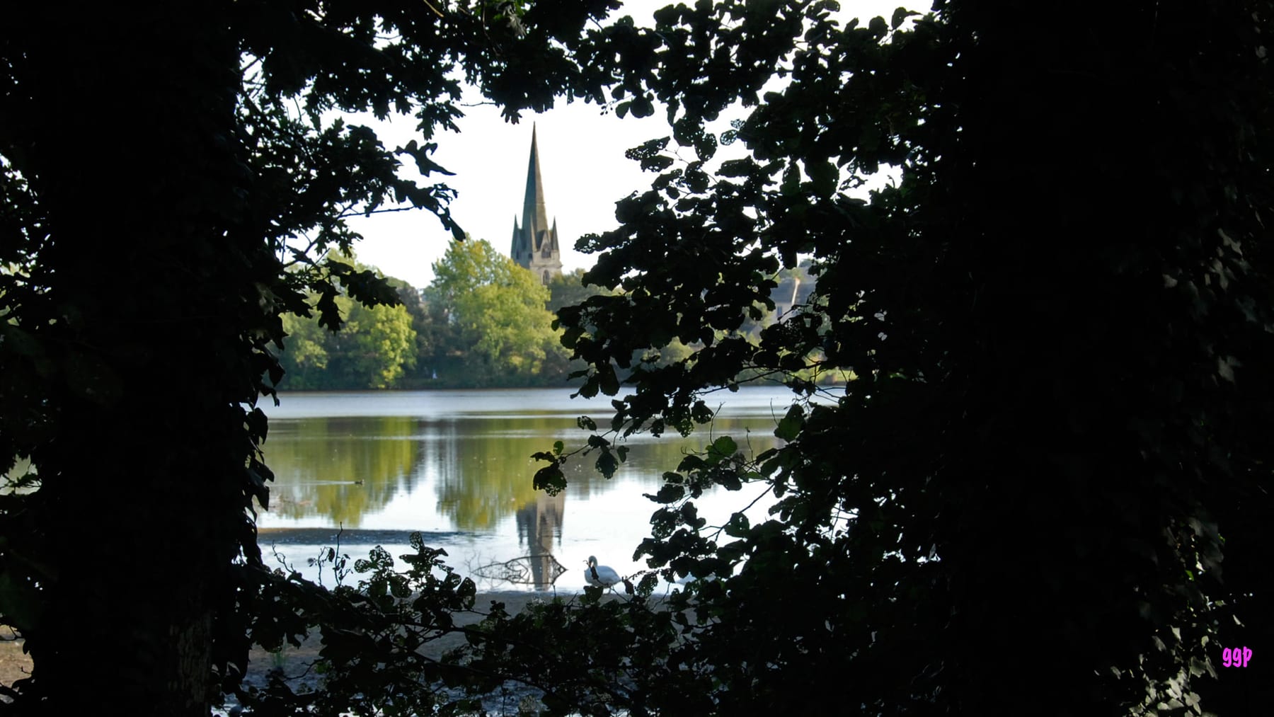 View of the lakes and church from the former railway line